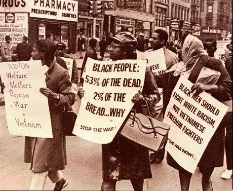 Picture of Black mothers holding protest signs in opposition against the Vietnam War